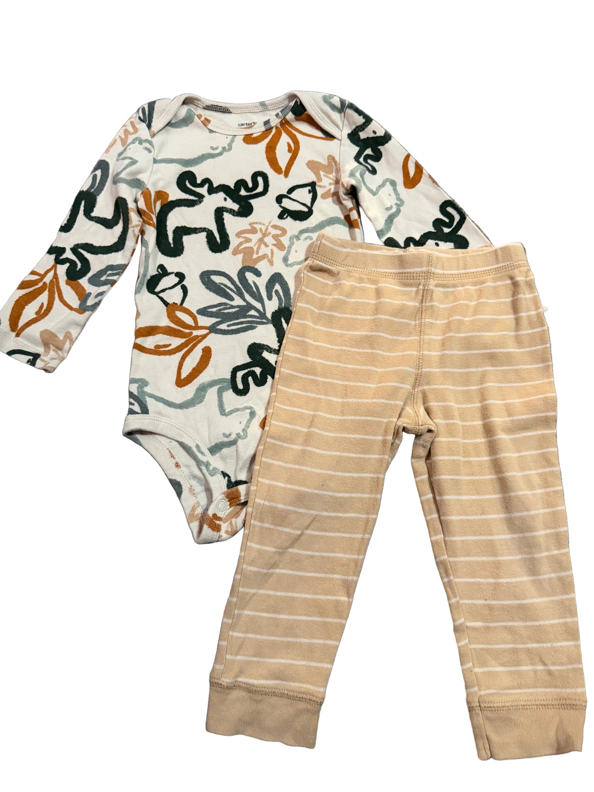 Beige pants and a patterned baby onesie