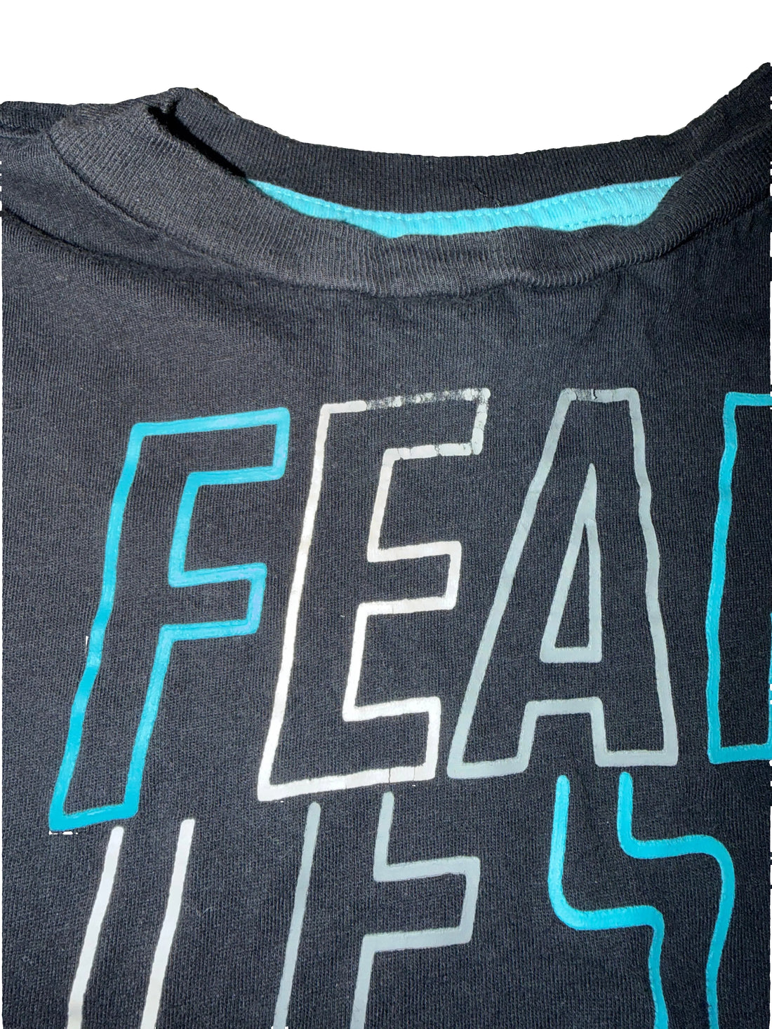 Black t-shirt with 'FEARLESS' text on a white background