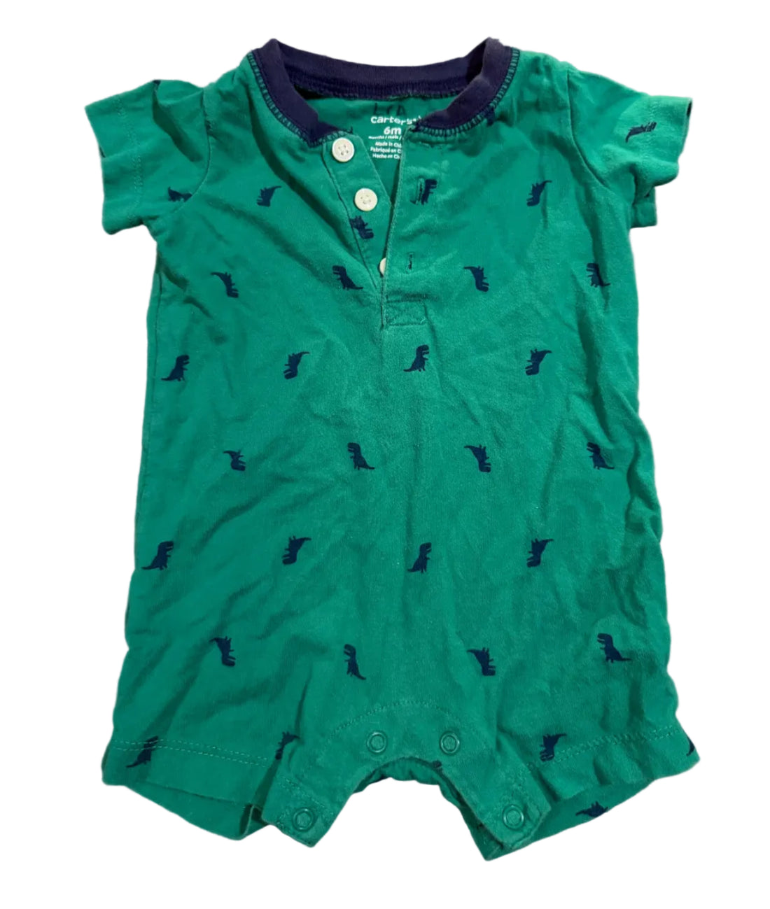 Green baby romper with small DINOS